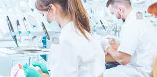 stock-photo-young-dentistry-students-having-practical-classes-on-anatomical-models-on-stomatology-course-387464680